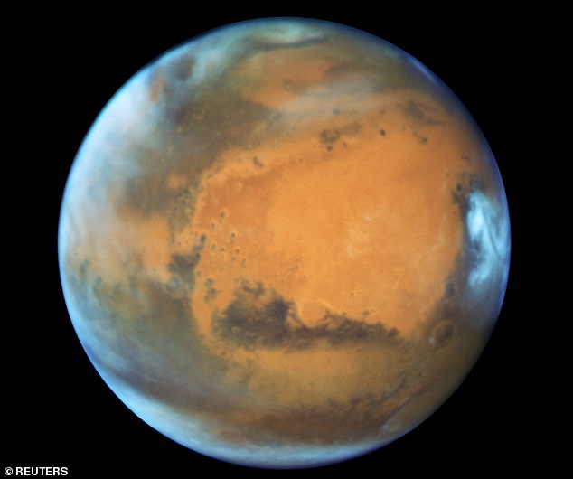 Near neighbour: Mars is the most obvious candidate for another world in our solar system to harbour alien life either past or present. NASA's Perseverance rover is currently collecting samples in its search for evidence of ancient life, which will be analysed on Earth in the 2030s