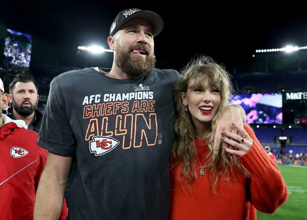 Travis Kelce #87 of the Kansas City Chiefs celebrates with Taylor Swift after a 17-10 victory