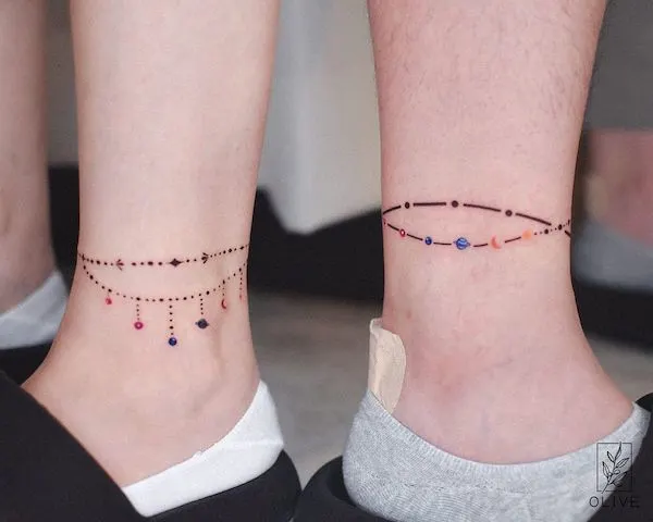 Cosmos anklet matching tattoos by @tattoo_artist_olive