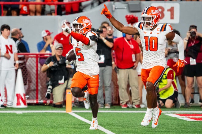 Illinois defensive back Torrie Cox Jr. (5) celebrates his interception against Nebraska.