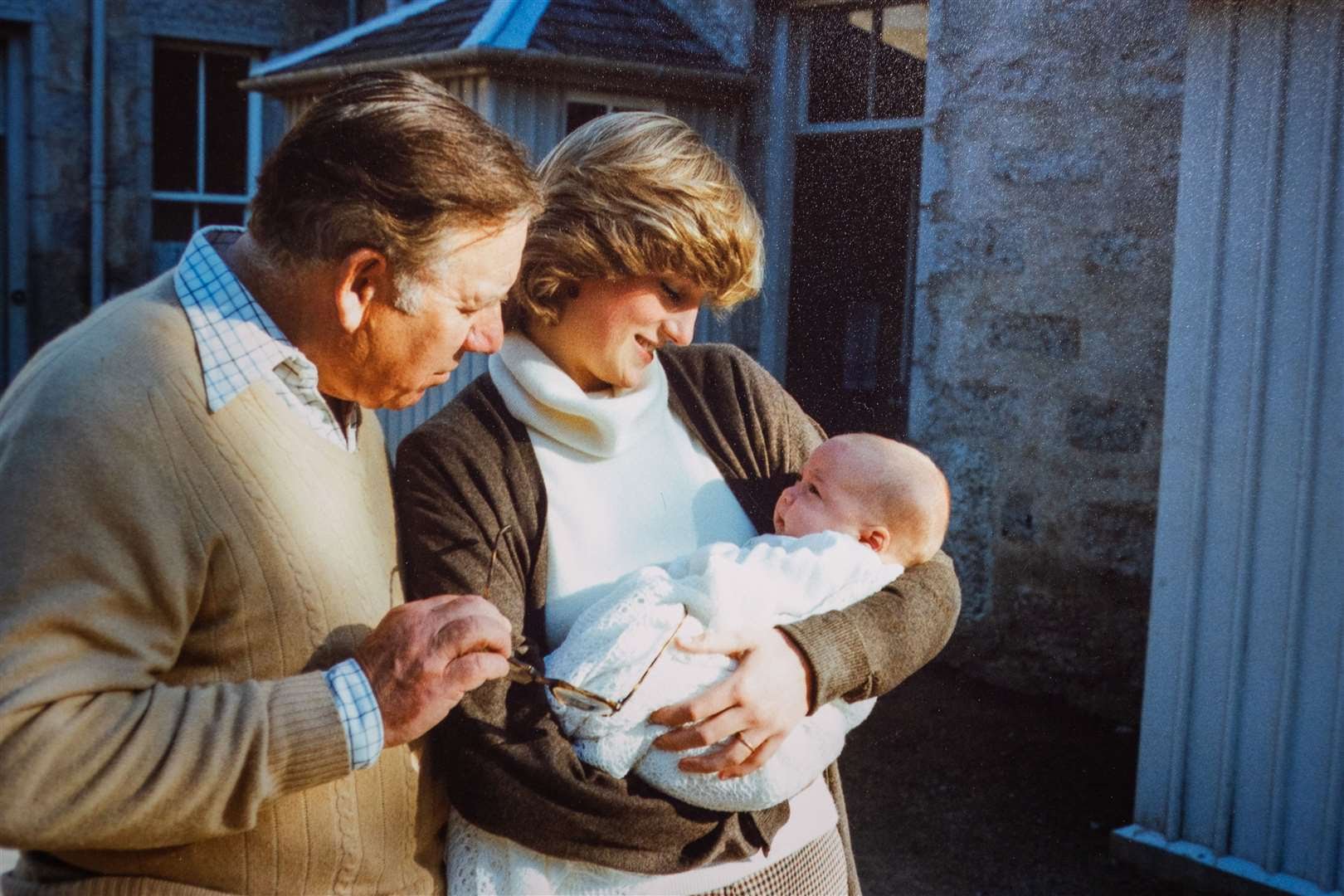 Princess Diana holding Prince William in September 1982 in Balmoral, Scotland. Also pictured is Lord King. Picture supplied by Willingham Auctions/Bav Media