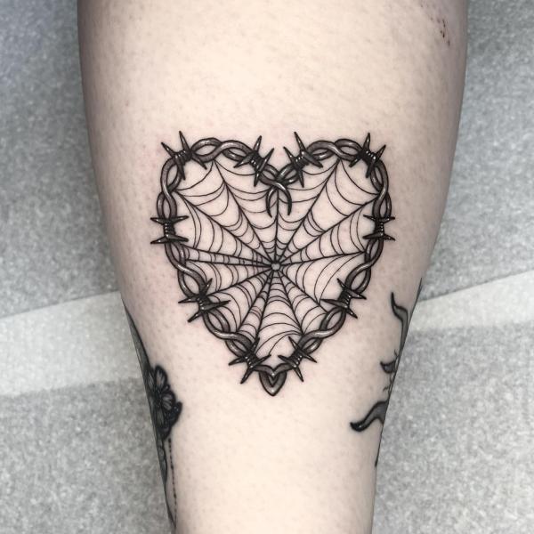 Barbed wire heart with spider web tattoo