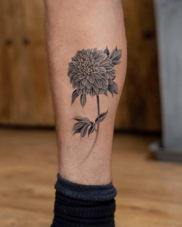 Grey dahlia lower leg tattoo