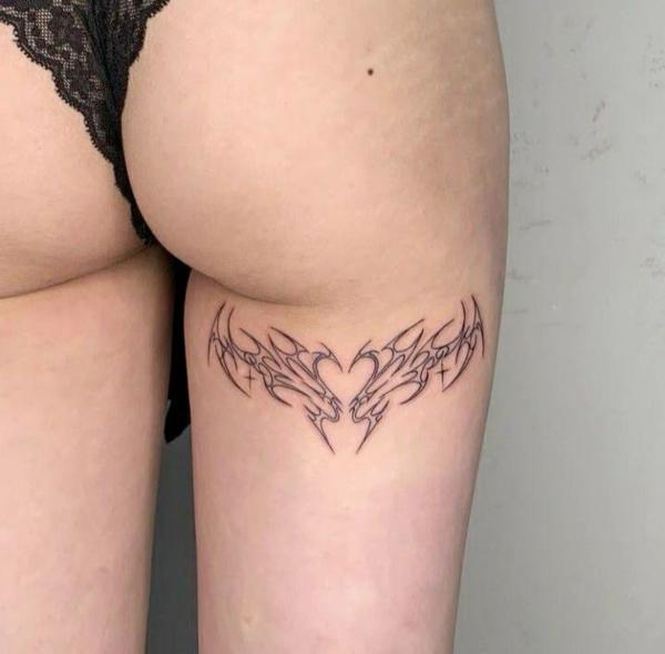 Heart cyber sigilism tattoo on back of thigh