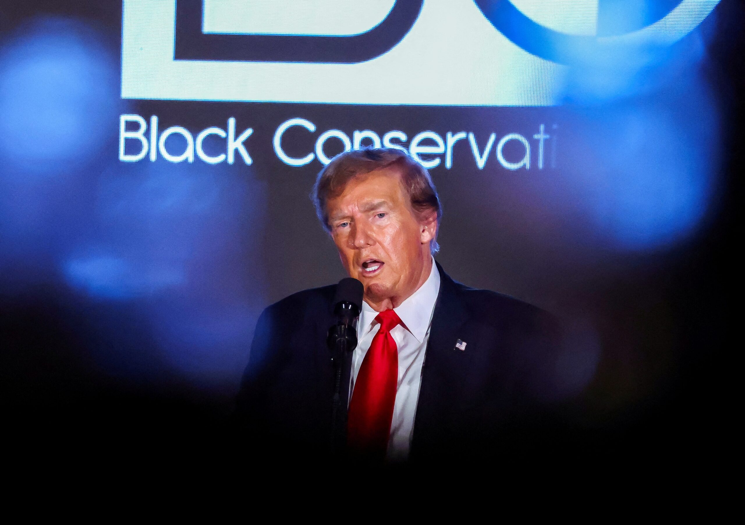 Donald Trump delivering a speech at the National Association of Black Journalists’ convention in July