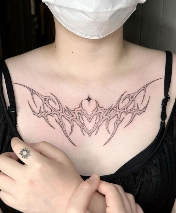 Star cyber sigilism chest tattoo