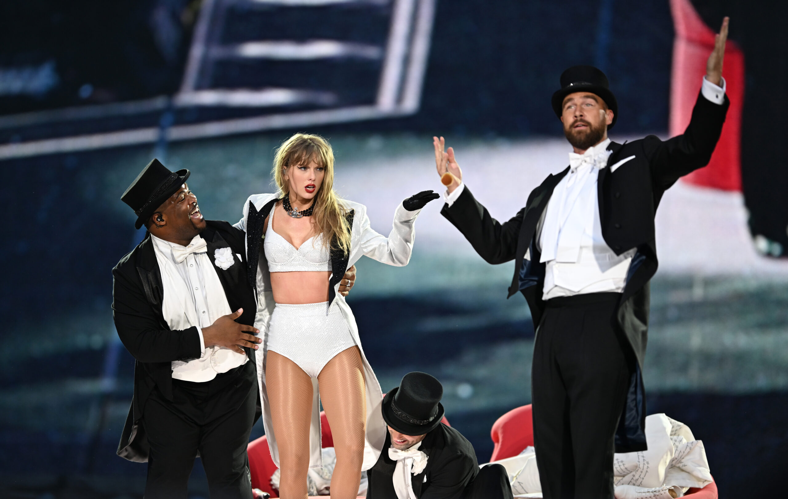 Taylor Swift is joined on stage by Travis Kelce (R), during “Taylor Swift | The Eras Tour” at Wembley Stadium