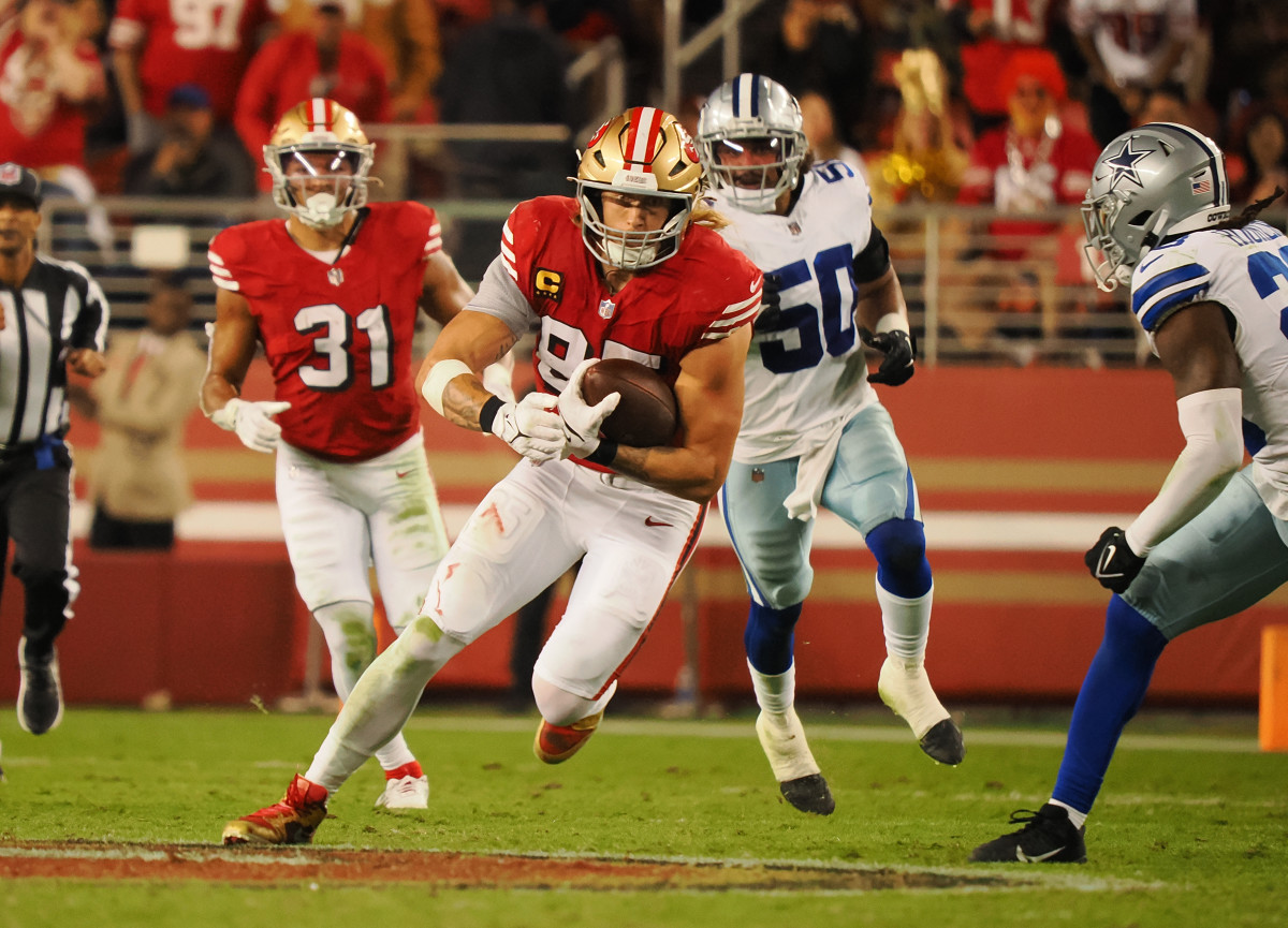 San Francisco 49ers tight end George Kittle (85) carries the ball against the Dallas Cowboys during the second quarter at Levi's Stadium.